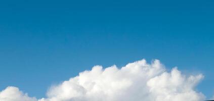 White fluffy cumulus clouds in the summer sky, natural clouds background photo