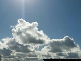 White fluffy cumulus clouds in the summer sky, natural clouds background photo