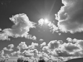 Black and white clouds in the sky background photo