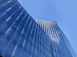 Modern office buildding over blue sky background photo