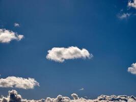 White fluffy clouds in the sky background. Cumulus clouds photo