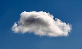 Cumulus clouds in the sky. Fluffy cloud shapes photo