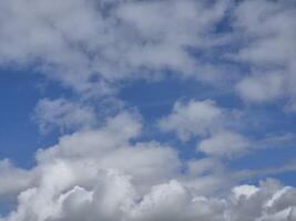 White fluffy clouds in the sky background. Cumulus clouds photo