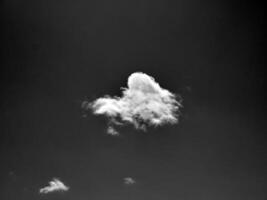 Black and white clouds in the sky background photo