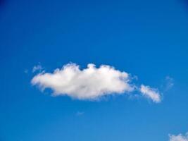 Cumulus clouds in the sky. Fluffy cloud shapes photo