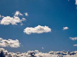 Cumulus clouds in the sky. Fluffy cloud shapes photo