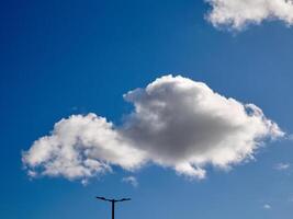 Cumulus clouds in the sky. Fluffy cloud shapes photo