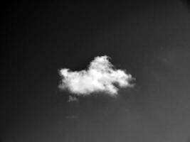 Black and white clouds in the sky background photo