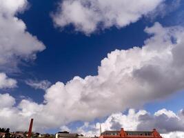 White fluffy cumulus clouds in the summer sky, natural clouds background photo