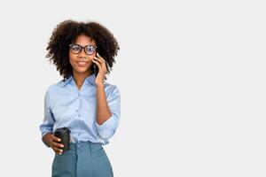 black woman holding a coffee cup and phone call, bussiness woman calling solated on white background photo