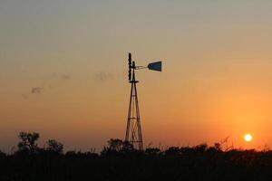 A Windmill at Sunset in South Texas. photo