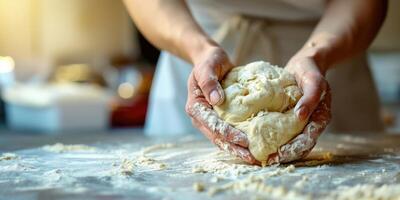 Hands knead fluffy dough. Homemade baking. Making homemade bread. Background with copy space photo