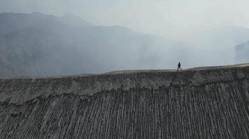 Man walk crater Bromo volcano video