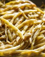 Fried long french beans in yellow ceramics cup. photo