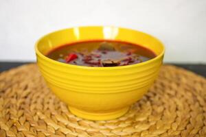 Red borscht or beetroot soup with sour cream photo