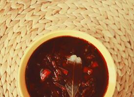 Red borscht or beetroot soup with sour cream. photo
