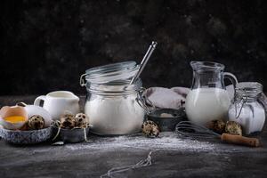 Baking ingredients with flour and eggs photo