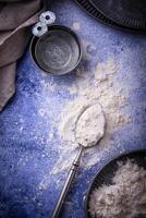 Wheat flour on dark. Baking background photo