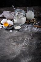 Baking ingredients with flour and eggs photo