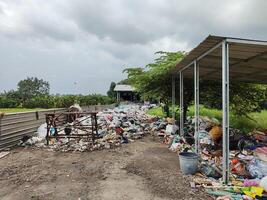 a container whose existence is to accommodate the waste of residents around it or its surroundings photo