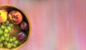 Top view of fruit in wicker basket on multi-hued background photo