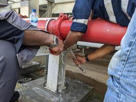 Rectify leakage on the pipe line connection fire fighting. The photo is suitable to use for industrial background and construction content media.