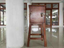 a charity box at a mosque in Surakarta, Indonesia photo