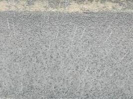 high angle view of raindrops on asphalt photo