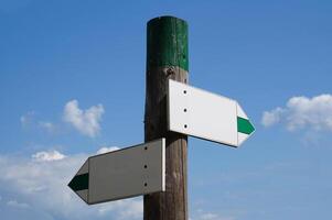 Wooden Signpost with Two Arrows photo