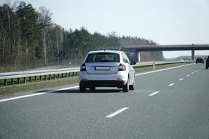 Car Drives on a Highway photo