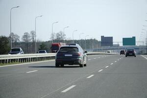 Cars Drive on a Highway photo