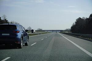 Car Drives on a Highway photo