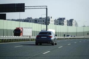 Car Drives on a Highway photo