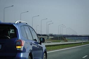 Car Drives on a Highway photo