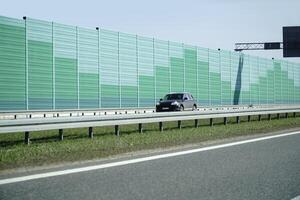 Car Drives on a Highway photo