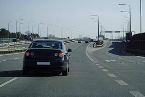 Car Drives on a Highway photo