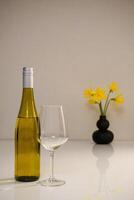 a bottle of white wine and a glass photo