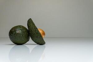 Green avocado on the table photo