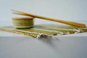 chopsticks and bowl of soy sauce photo