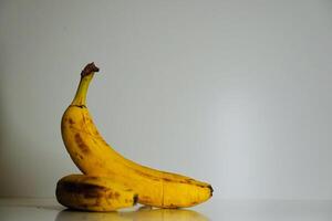 yellow bananas on a white background photo