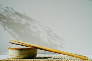 chopsticks and bowl of soy sauce photo