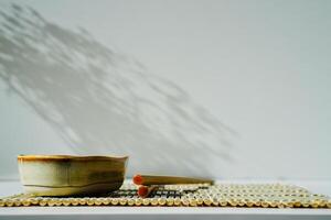 chopsticks and bowl of soy sauce photo