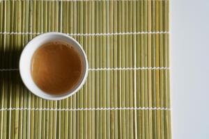 chopsticks and bowl of soy sauce photo