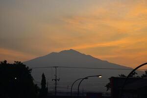 Silhouette Mountain at morning sunshine photo