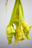 Close up Ketupat and copy space with isolated white background. Traditional culture in indonesia welcoming ramadhan season photo