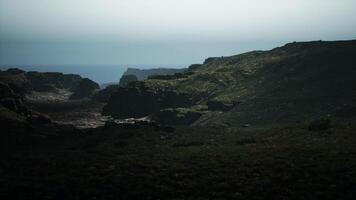 A view of the ocean from the top of a hill. mountain path video