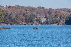 Men in a boat duck hunting photo