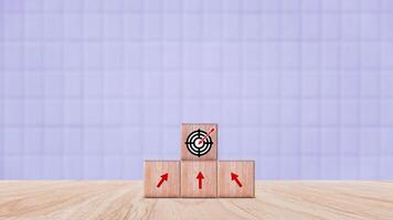 Target concept, objective, virtual target board and rising arrows screen printed on wooden cubes. set goals for business success. photo