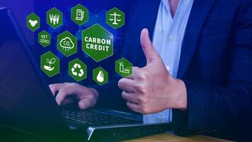Green energy, Carbon credit market concept, Businessman holding Carbon credit icon, Net zero, Green energy icon. Carbon Neutral in industry Net zero emission eco energy. photo