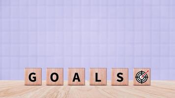 Target concept, objective, virtual target board and rising arrows screen printed on wooden cubes. set goals for business success. photo